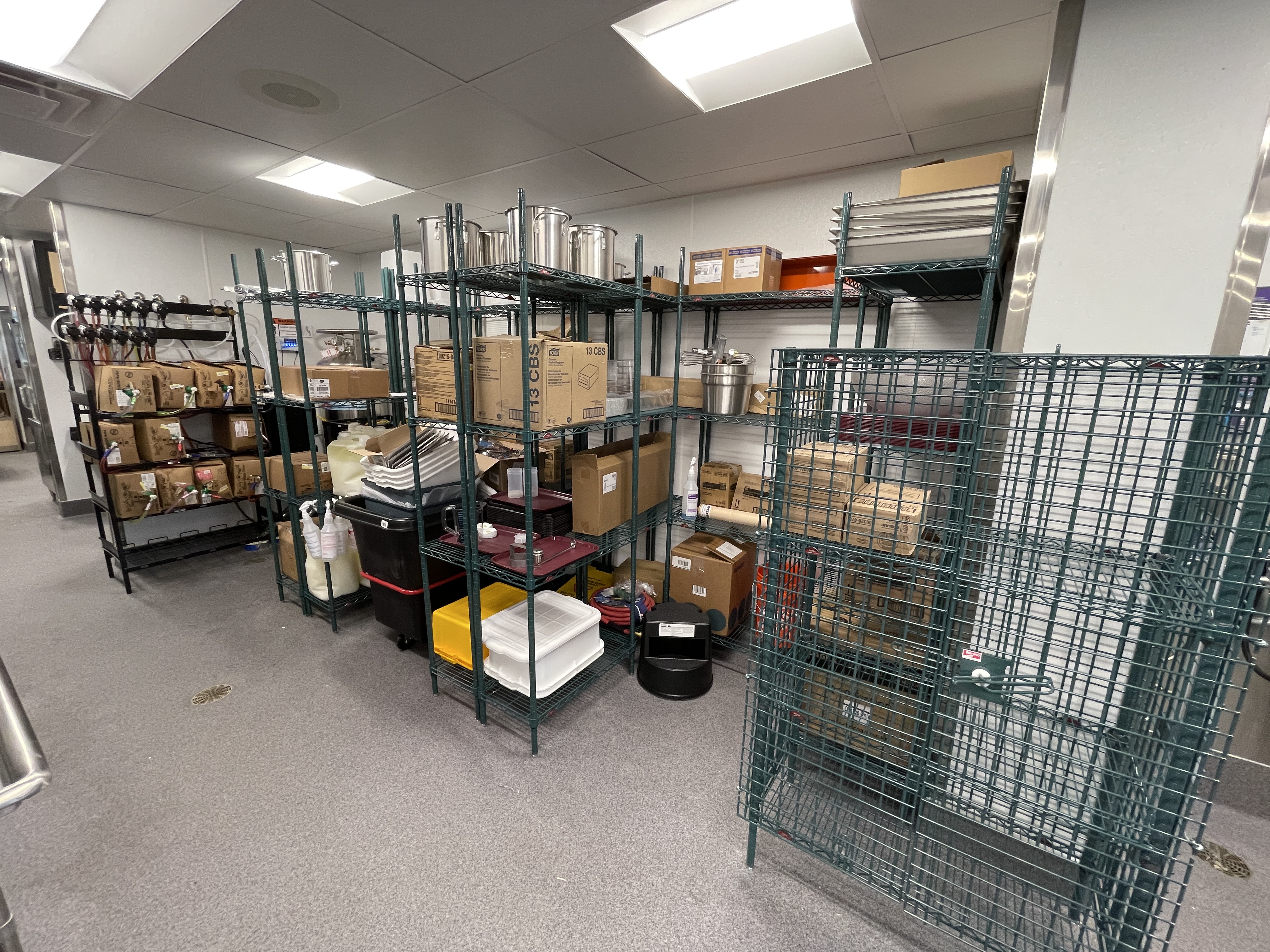 Back-of-house storage and smallwares staged for restaurant opening readiness