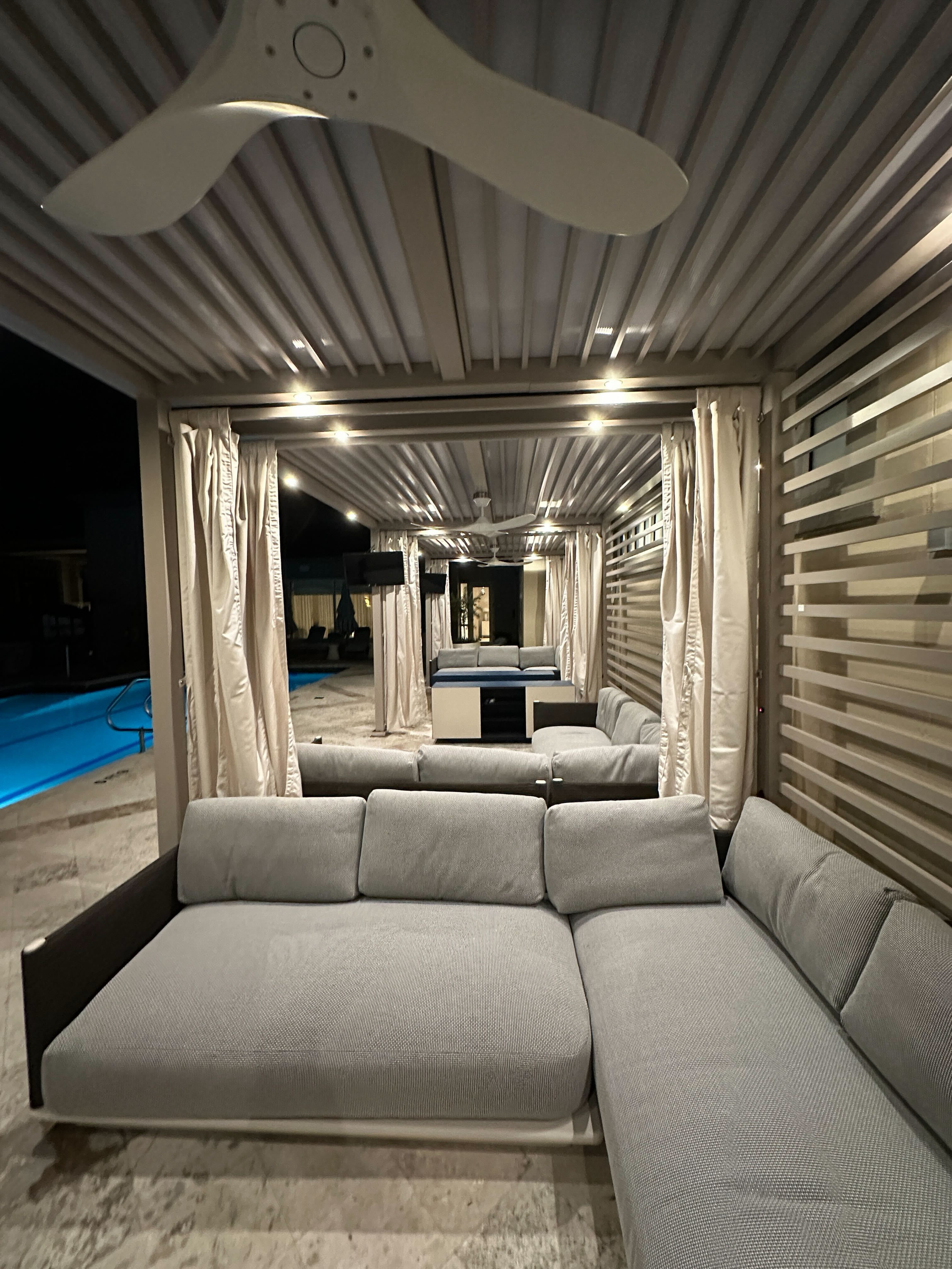 Looking through the cabana depth — pool visible in background