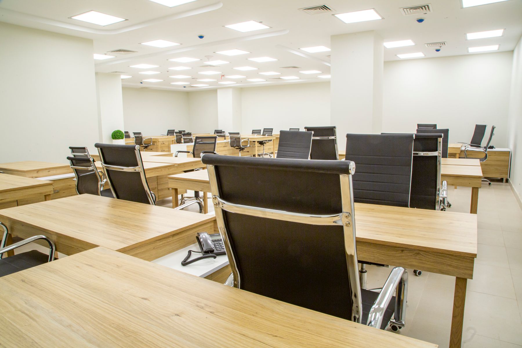 Representative modern workplace with desks and workstations