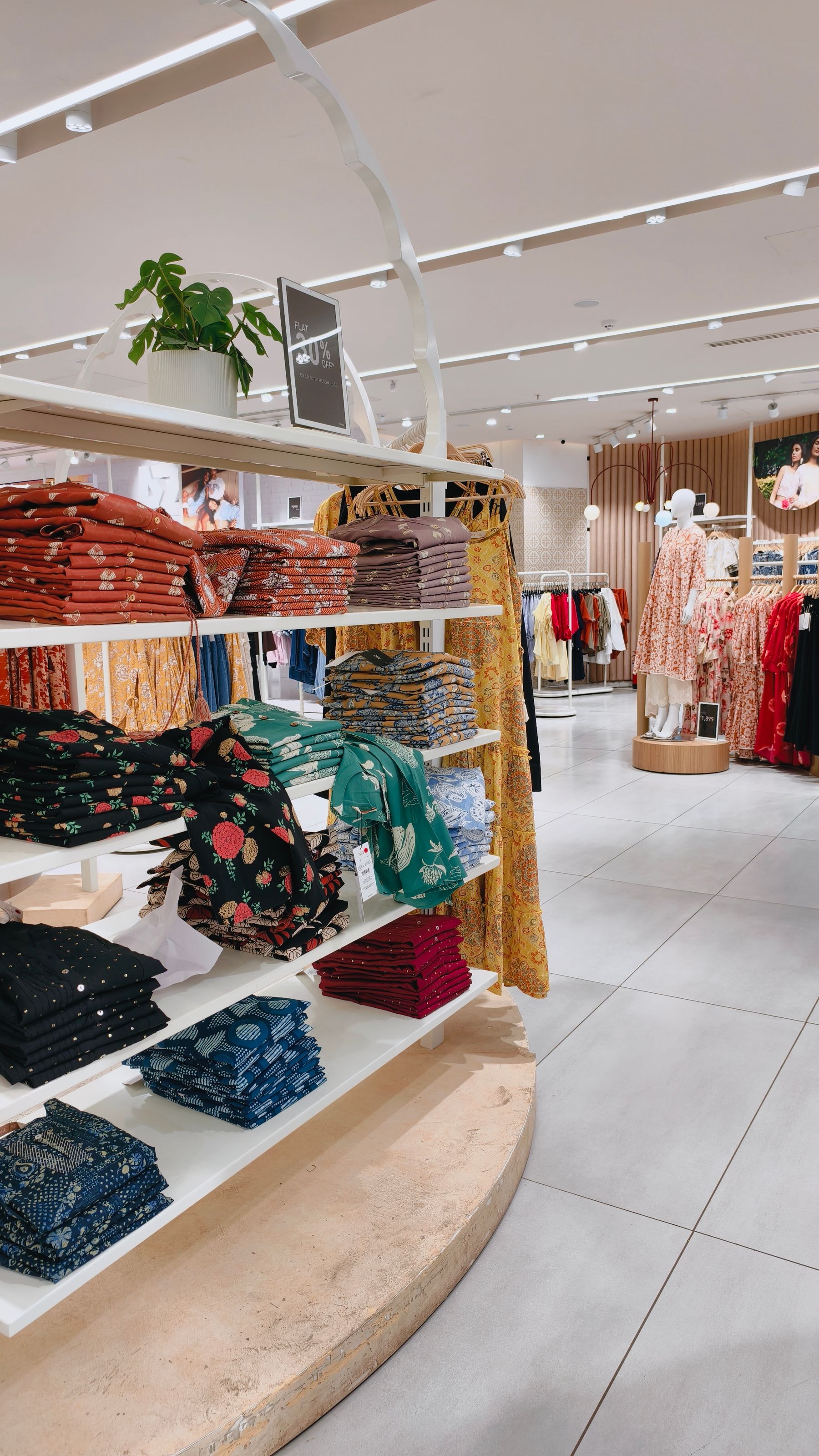 Representative professional clothing store with merchandise displays and fixtures